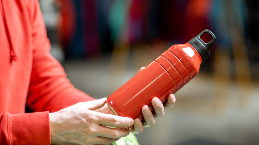 holding red thermos for hiking 2023 11 27 05 35 29 utc scaled