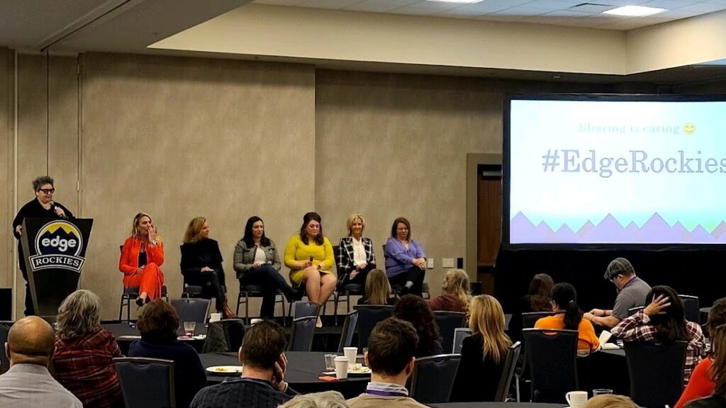 a panel of women speaking at an event