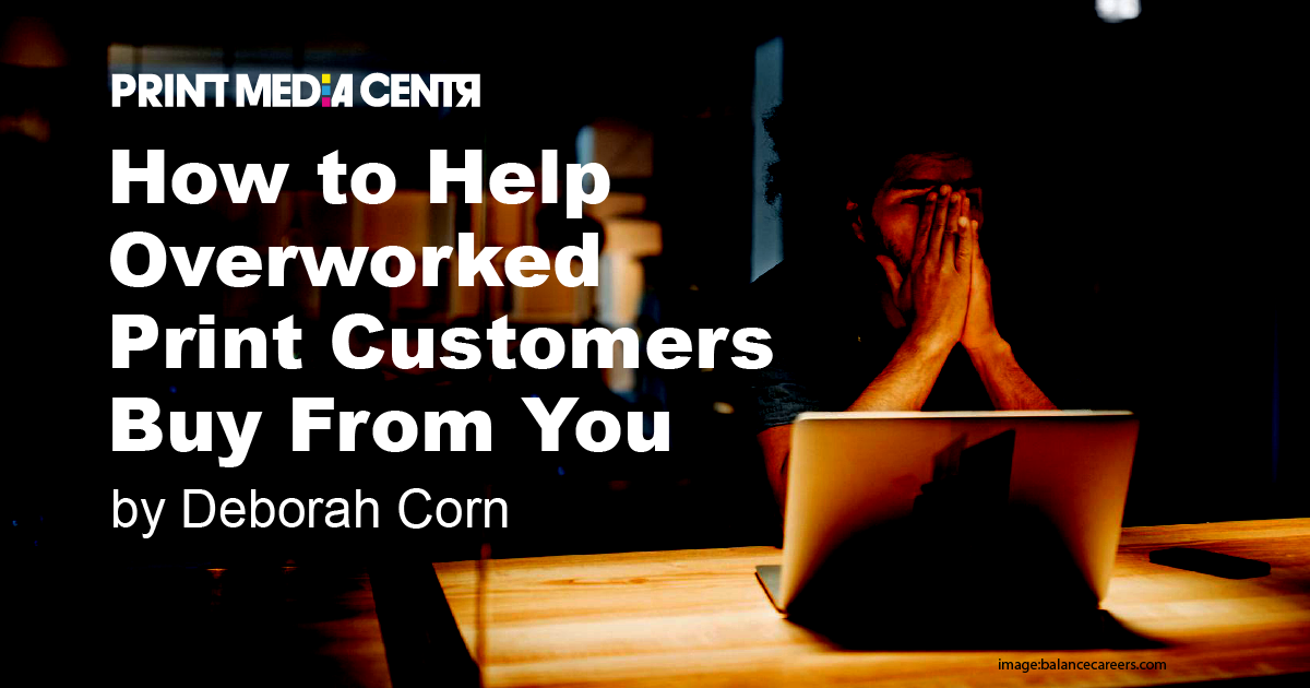 overworked employee in dark office